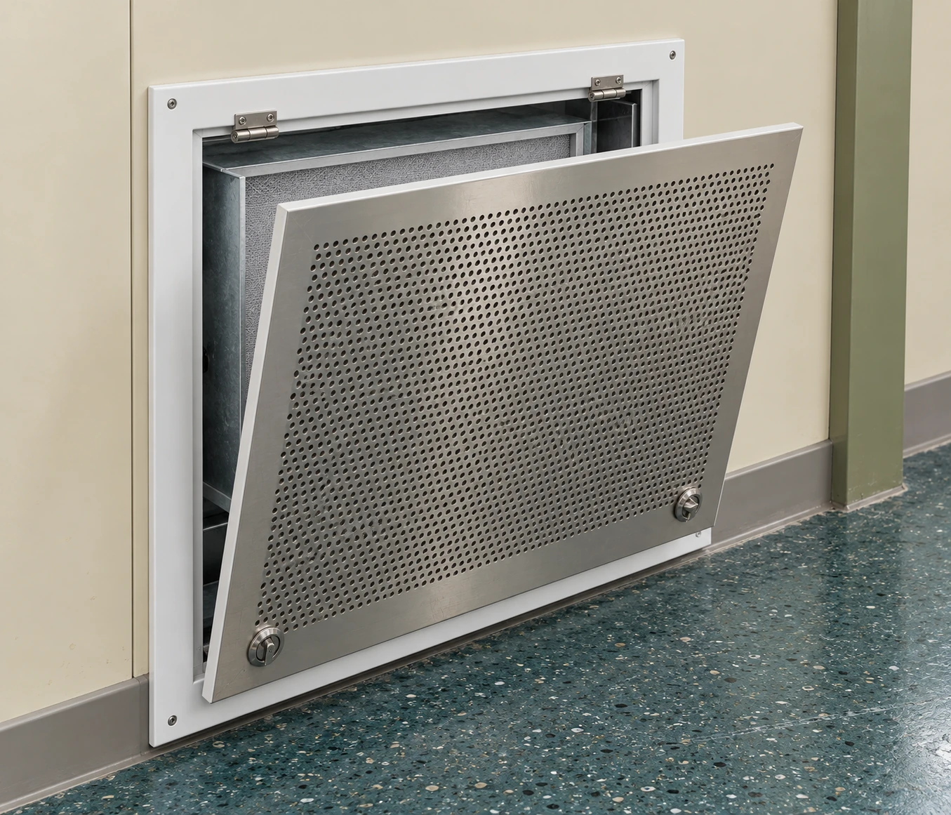 Hinged perforated air return panel with filter access at a modular wall base