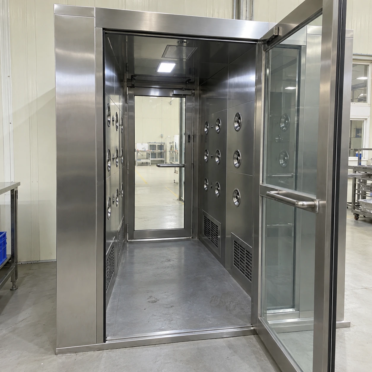 Interior of an air shower chamber showing nozzle walls and separate doors