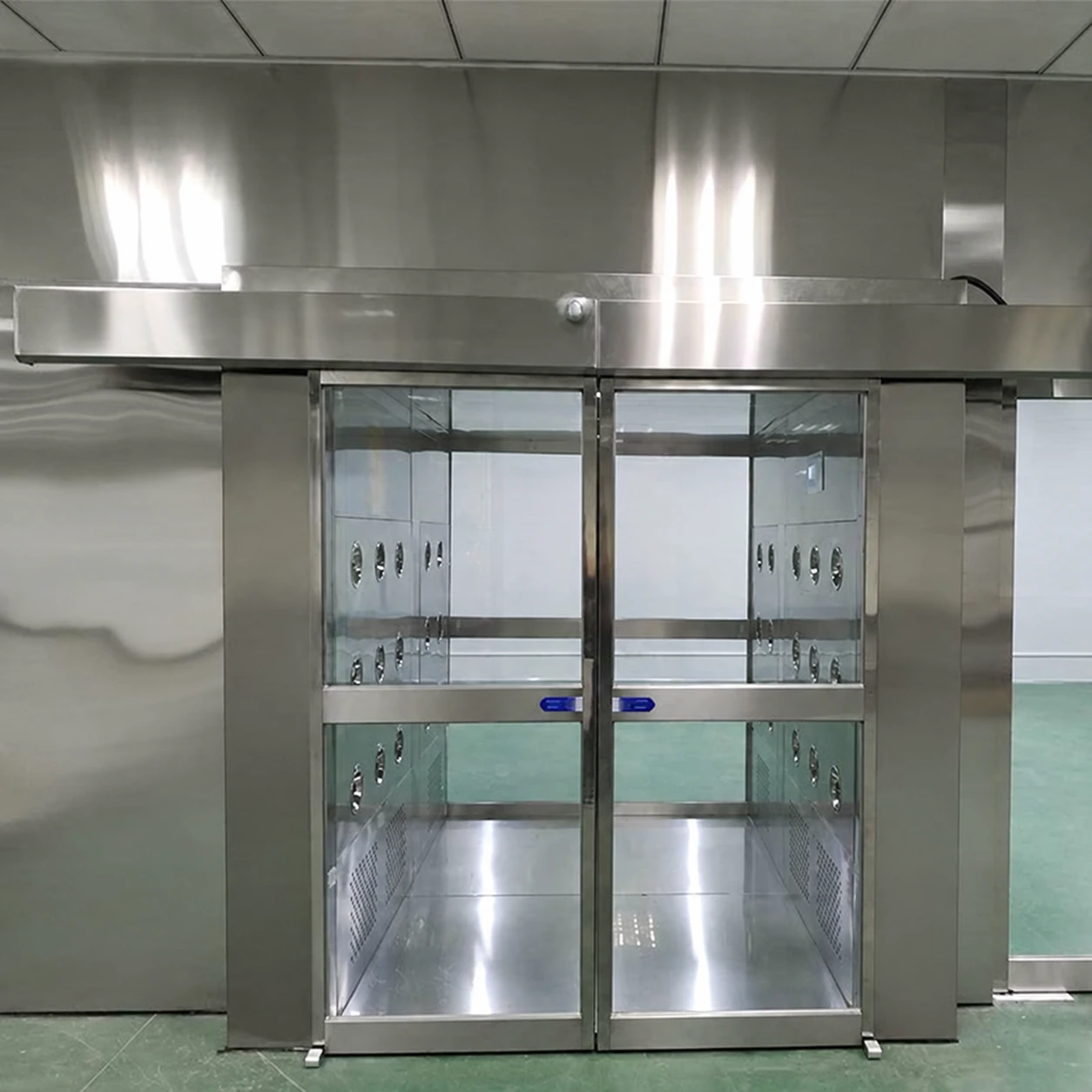 Wide stainless air shower at an industrial cleanroom entrance