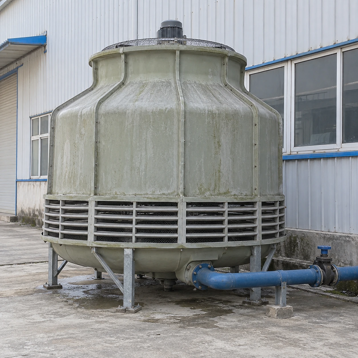 Ordinary round industrial cooling tower serving a small factory water circuit