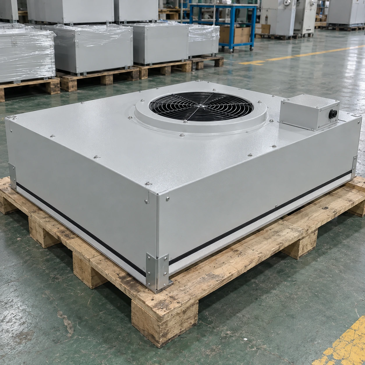 Light grey fan filter unit with a top intake and side connection box