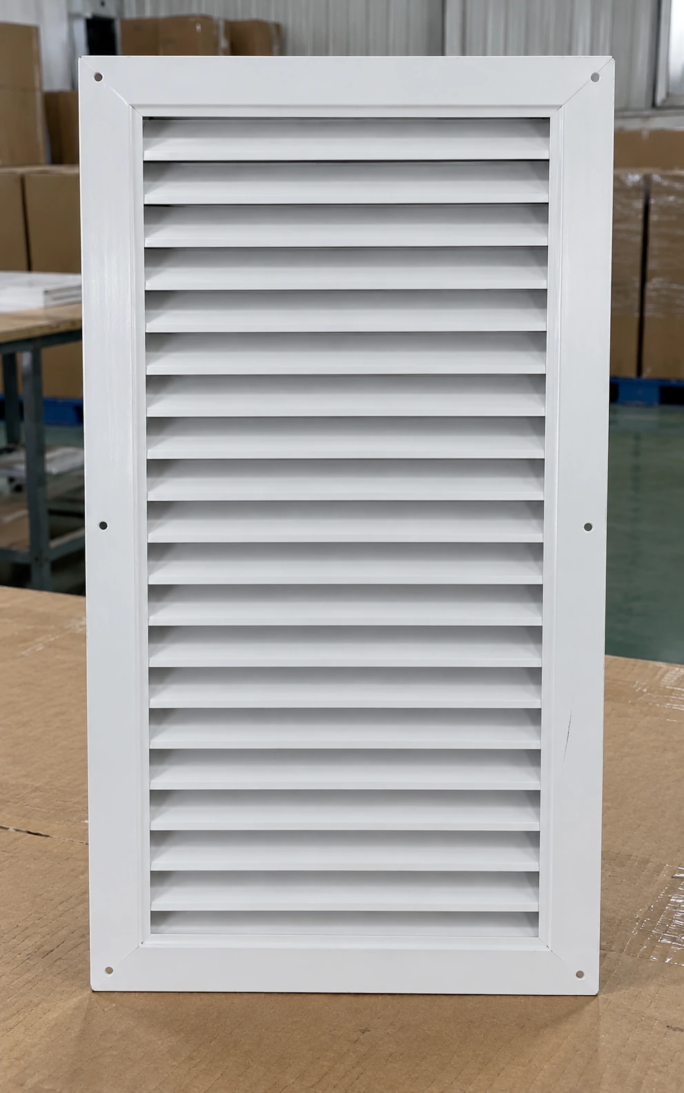 Tall sixteen-by-twenty-five white sheet-metal return grille with plain flange