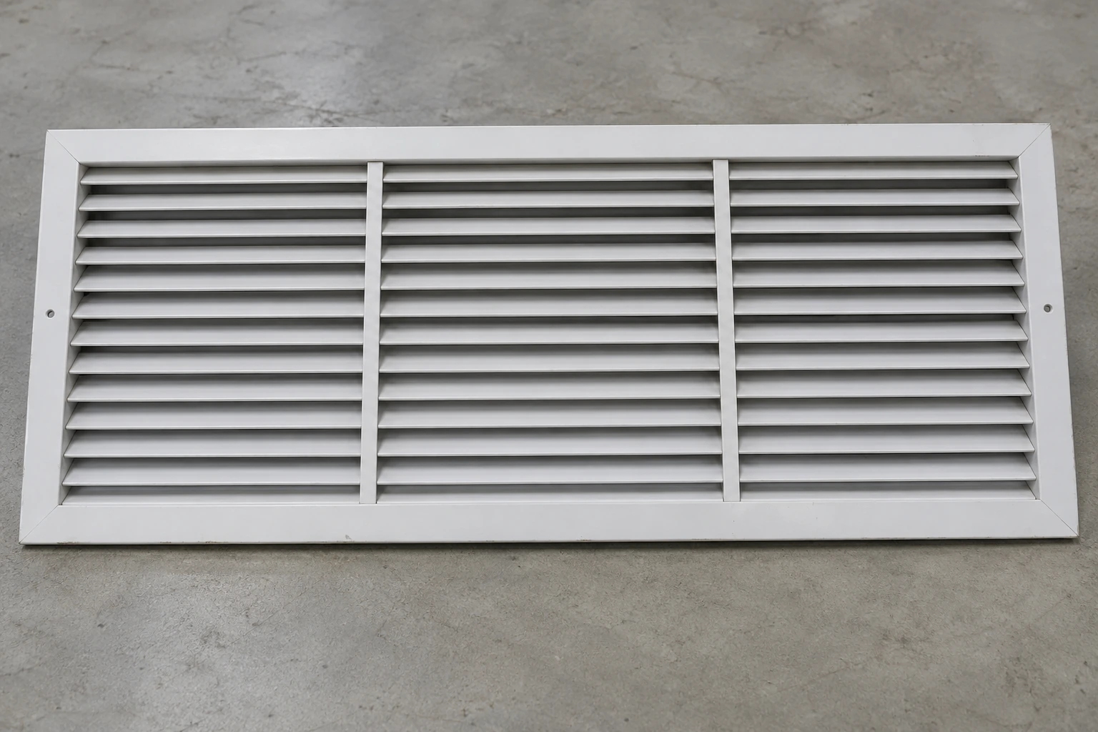 Wide thirty-by-twenty white return grille with horizontal blades and internal supports
