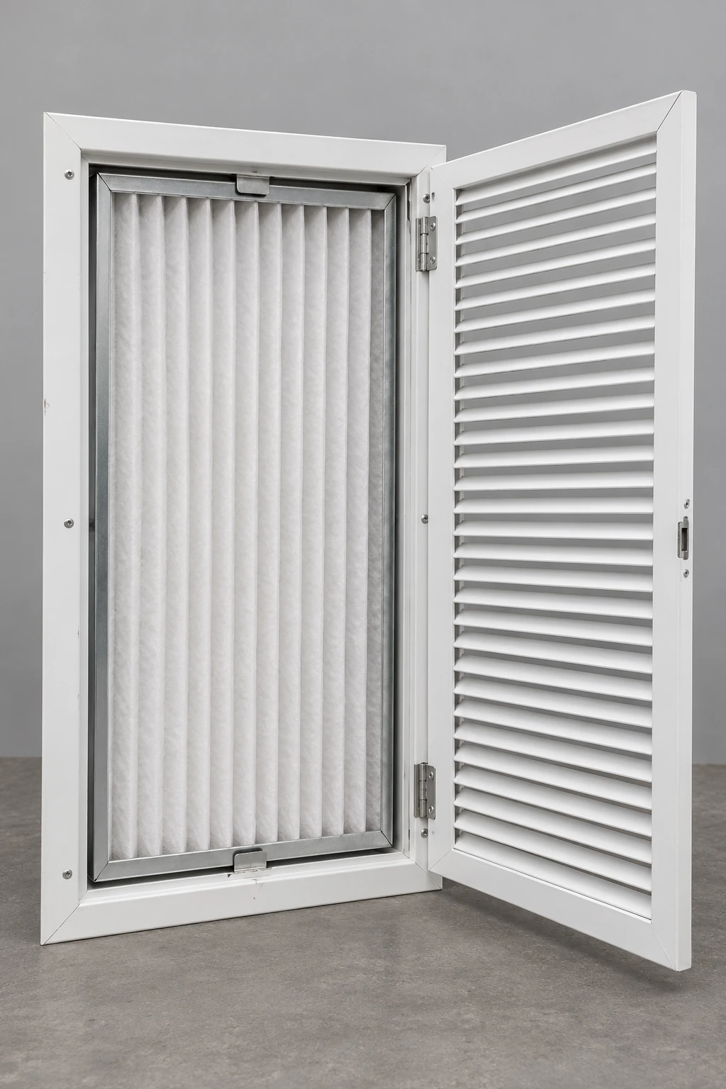 Tall white return filter grille with hinged louver door and visible pleated panel filter