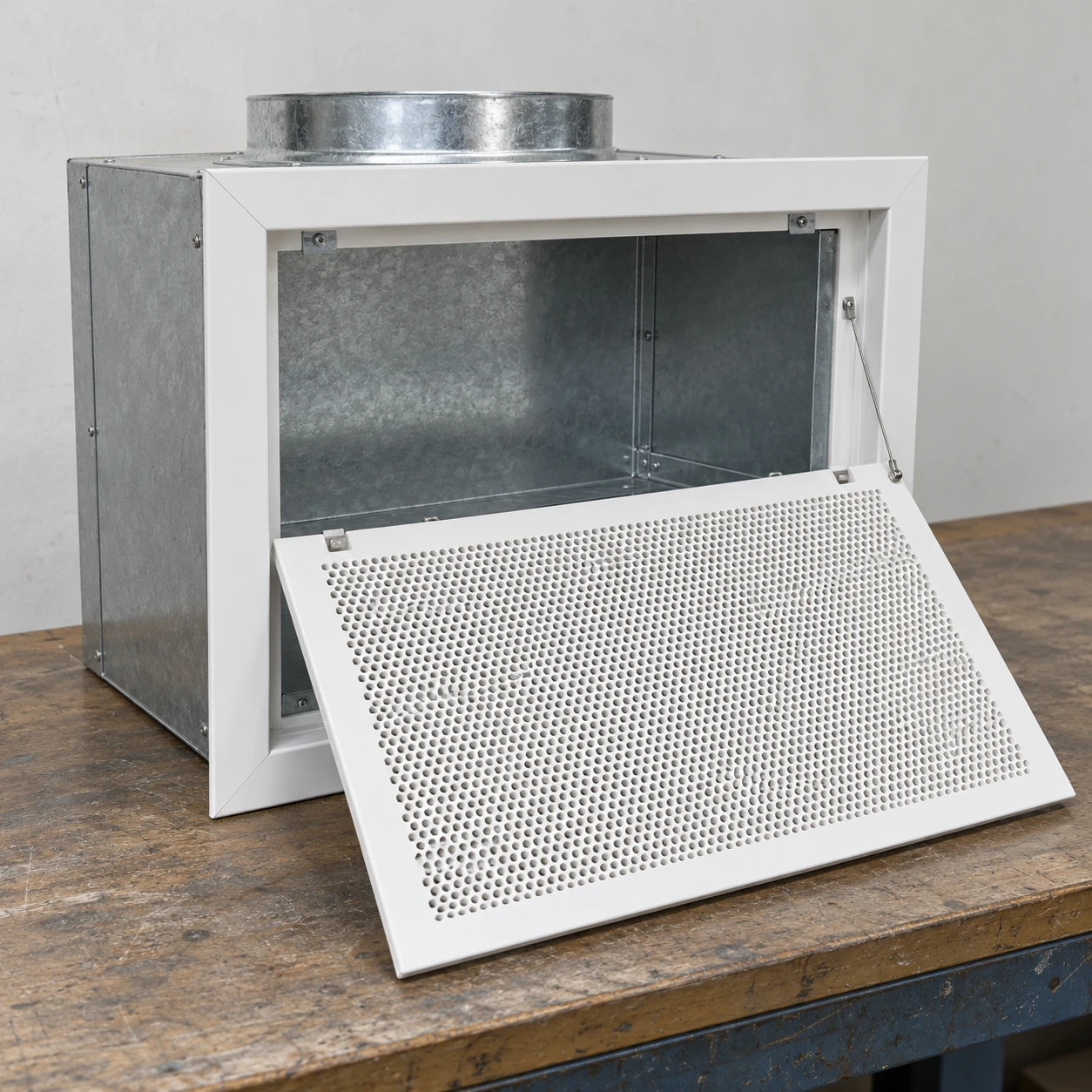 White ceiling return grille with lowered removable face and shallow galvanized plenum
