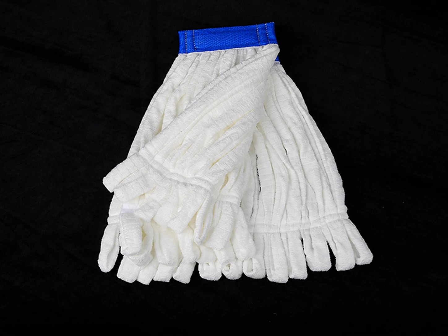 Reverse of the strip mop refill with retaining stitches