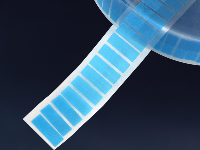 Rectangular adhesive pieces on the blue liner