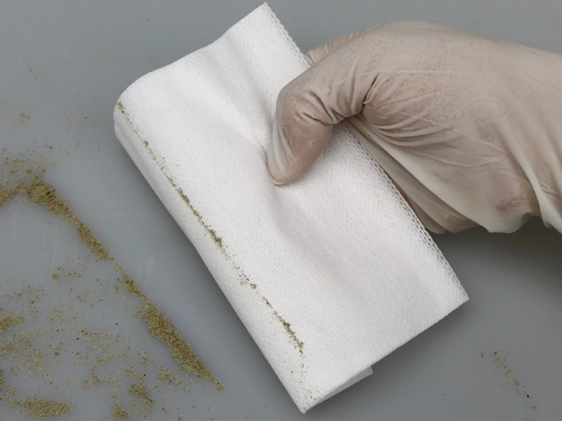Loose-particle surface wiping
