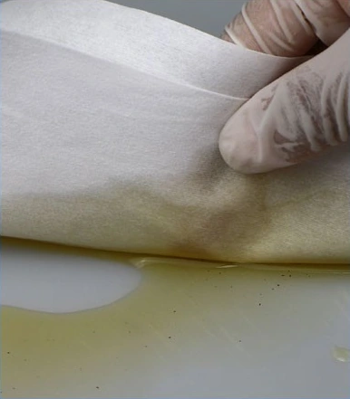120 Sheet Pre-Saturated Wipes in a Bucket — Bucket wipe used on a work surface
