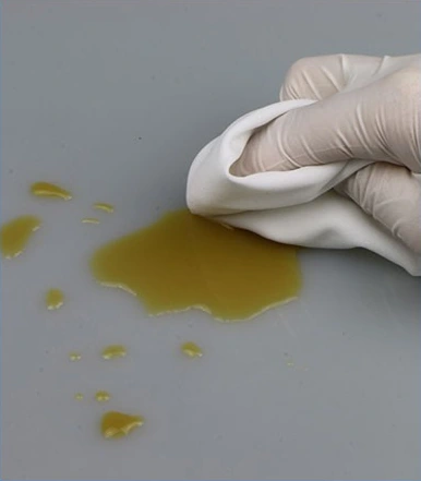 1006S Pre-Saturated Polyester Wipes — Wipe in contact with a work surface